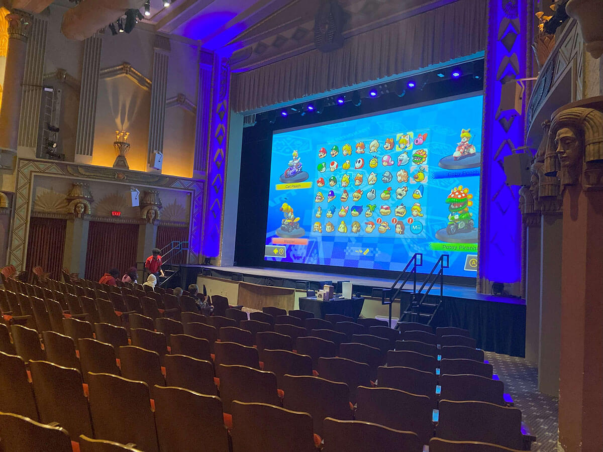 Community members play video games at the Egyptian Theatre.
