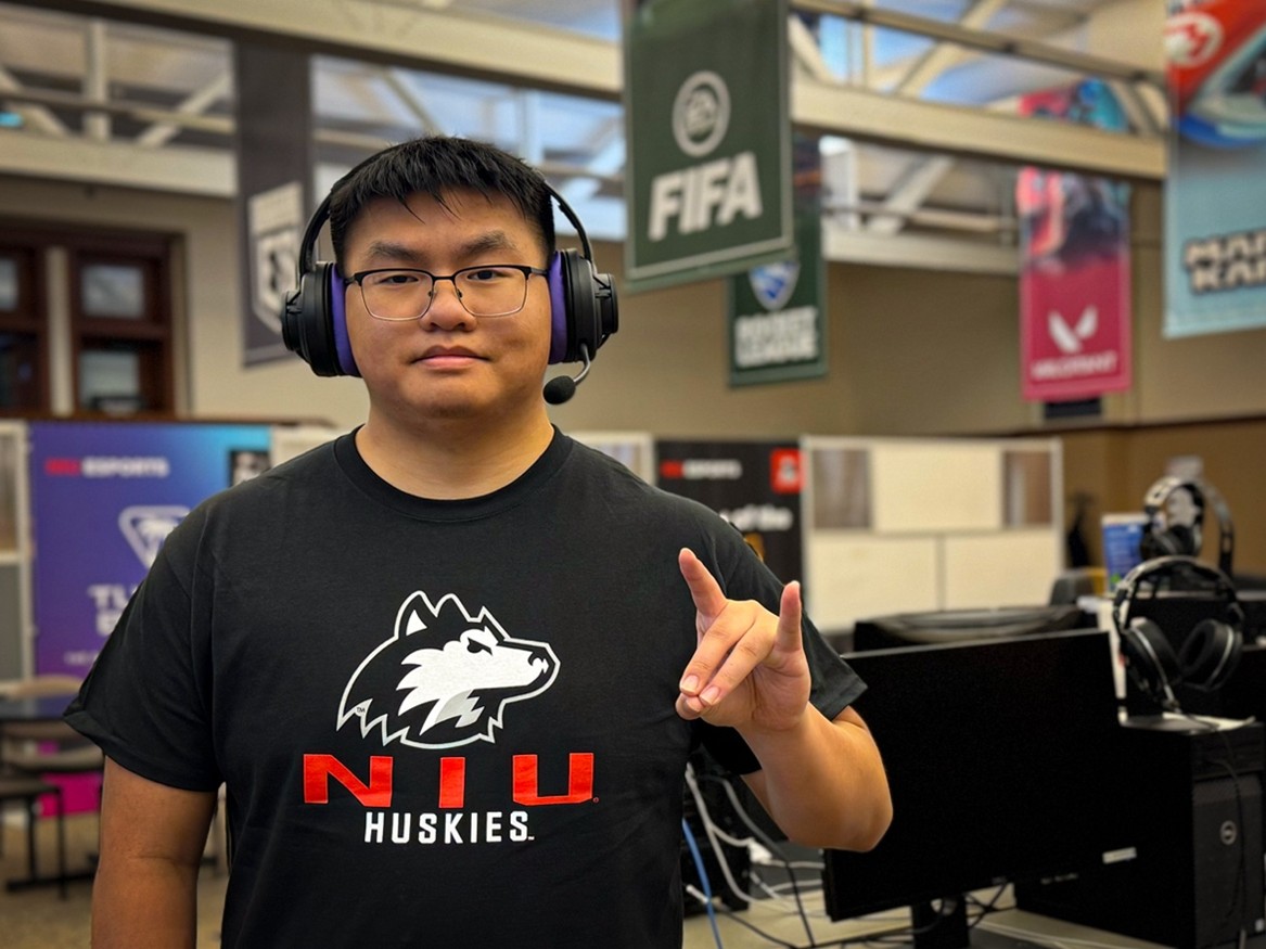 Ethan Nguyen, in the NIU Esports Arena, wears the Turtle Beach Atlas Air Wireless Open Back Gaming Headset.